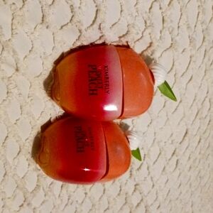 2 Kimberly sweet peach perfumes ( basically half full )
